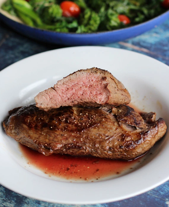 Perfect Pan-Seared Teres Major Steaks with Broccoli Raab and Grape Tomatoes