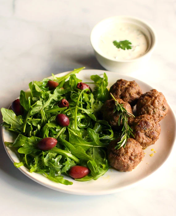 Mediterranean Lamb Meatballs with Cilantro Crema and Arugula-Olive Salad